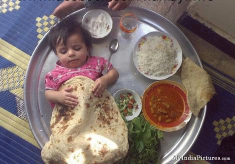 indian-cute-baby-girl-funny-food-plate.jpg